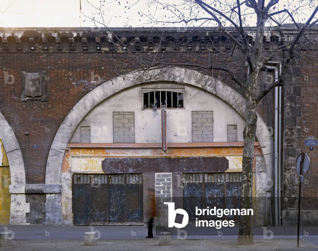 View of the arcs avenue Daumesnil in Paris. In 1990, the former Viaduct of Paris was renoved by Patrick Berger. Built in 1859, it connected the Bastille by rail to Vincennes. The construction of the Opera Bastille will lead to the rehabilitation of the Viaduc rachete at the SNCF by the Paris City Hall. The vaults desormais restaurees are home to artisans of art and creation.