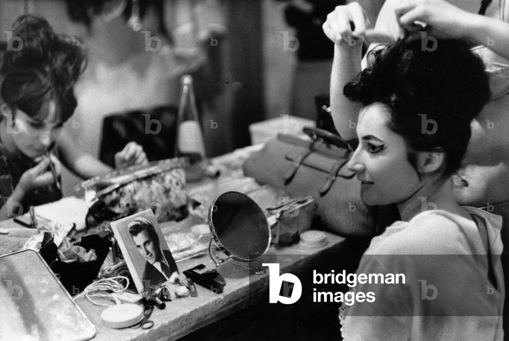 A young dancer is preparing for a show.