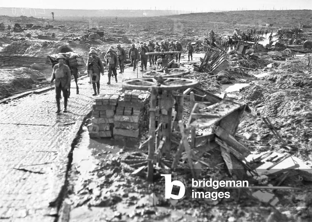 Australian troops passing along the track leading to Idiot Corner, at Westhoek Ridge, in the Ypres sector, 28 October 1917 (b/w photo)