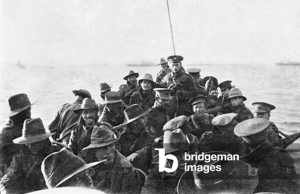 A view looking aft of lifeboat carrying unidentified men of the Australian 1st Divisional Signal Company, as they are towed towards Anzac Cove at 6 am on the day of the landing, 25 April 1915 (b/w photo)