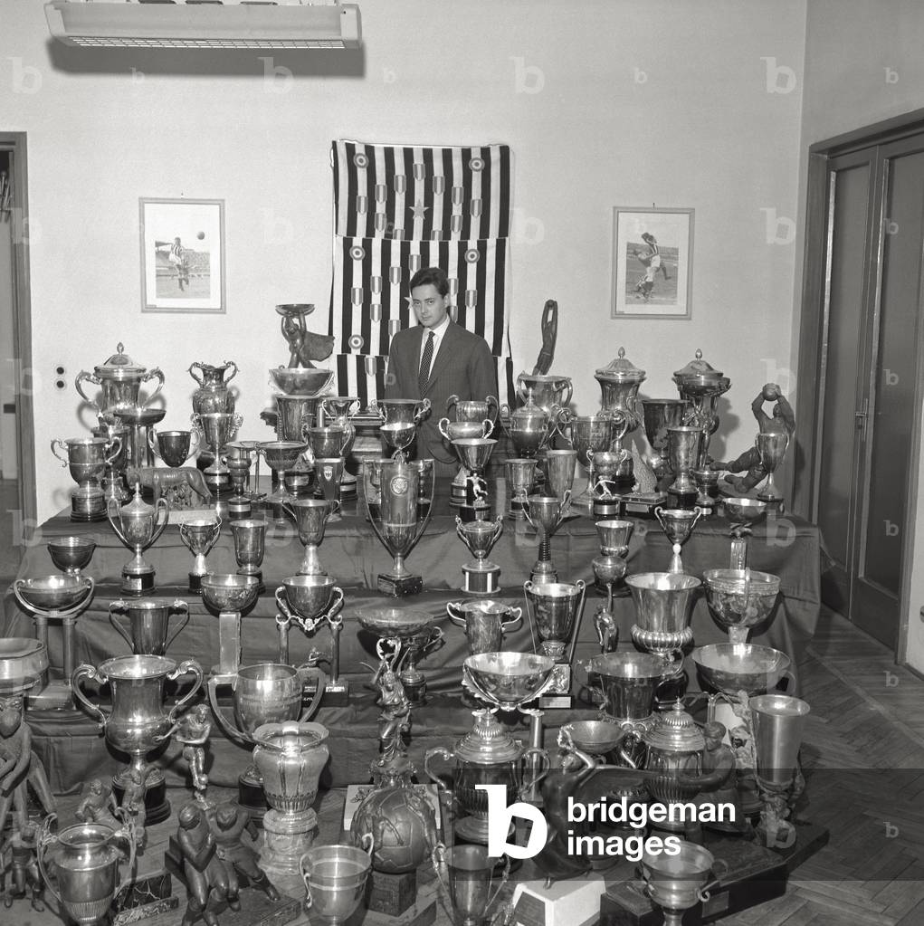 Umberto Agnelli among trophies, 1962 (b/w photo)