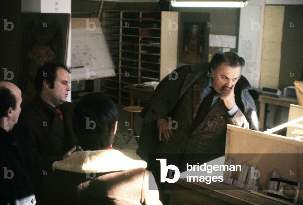 Federico Fellini studying the set design for a movie, Italy, 1969 (photo)