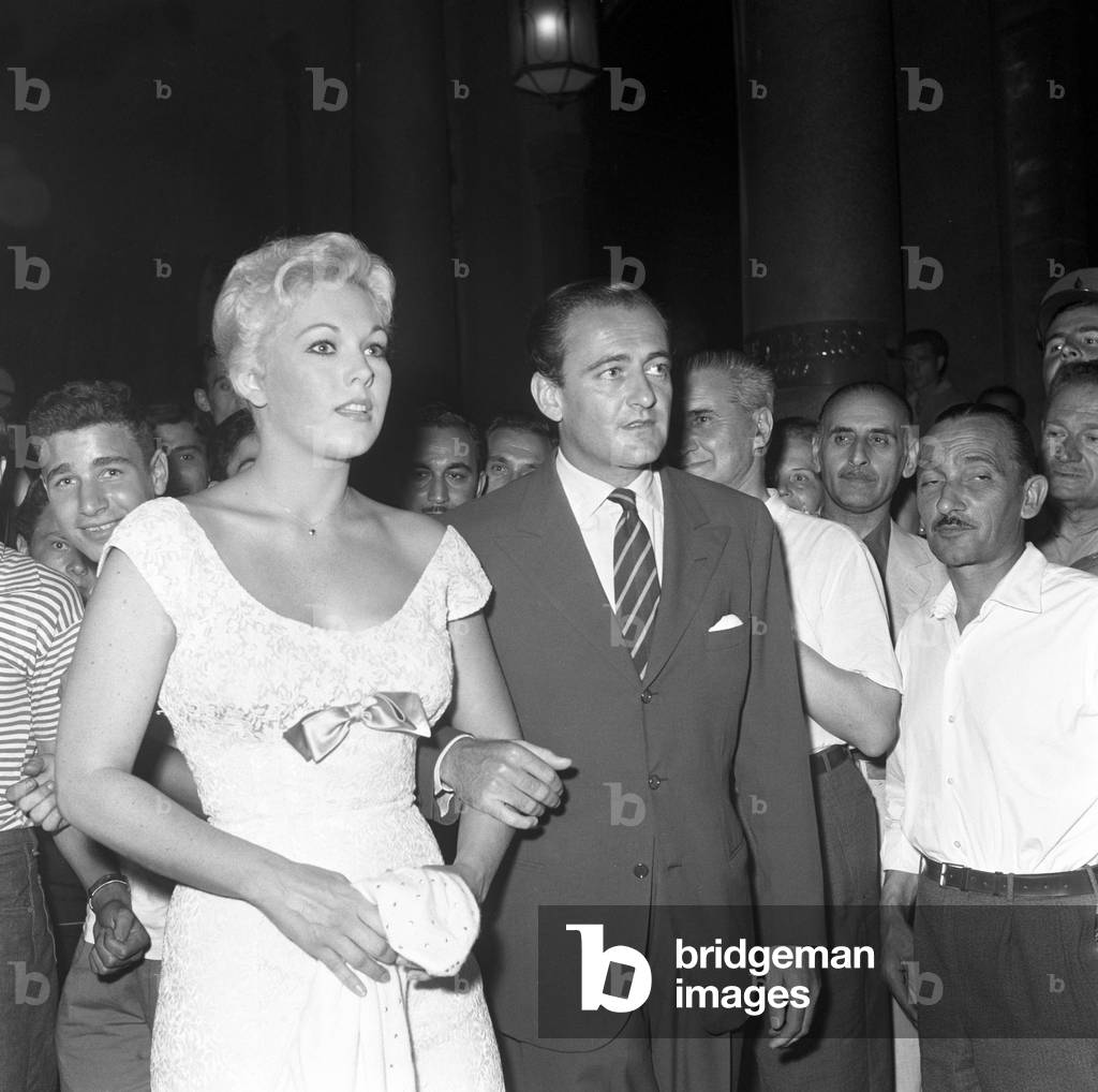 Kim Novak and Mario Bandini Pallavicini walking in Rome, Italy, 1956 (b/w photo)