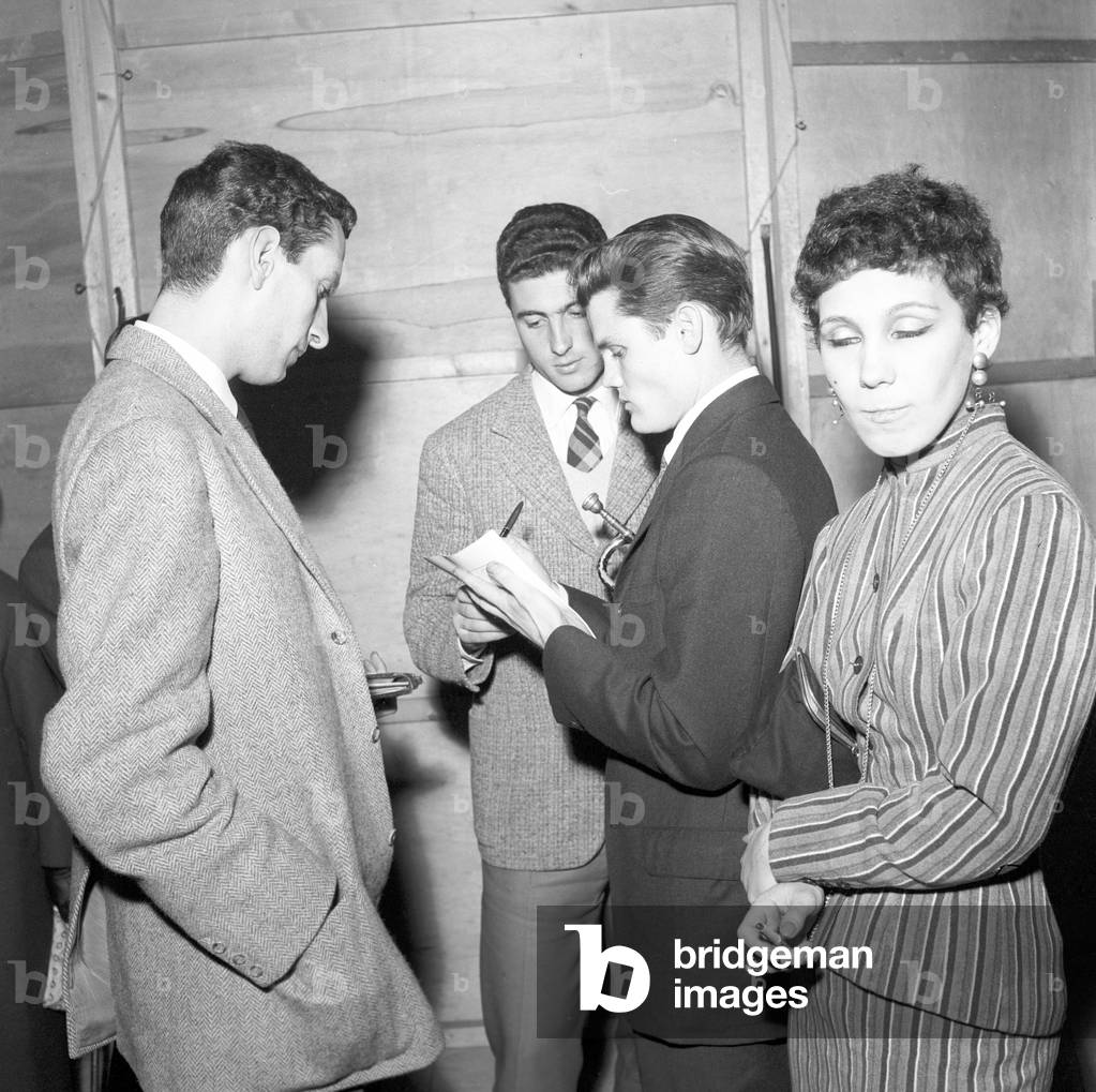 Chet Baker signing autographs (b/w photo)