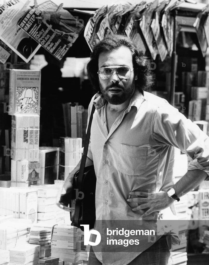 Antonello Venditti beside a book stall