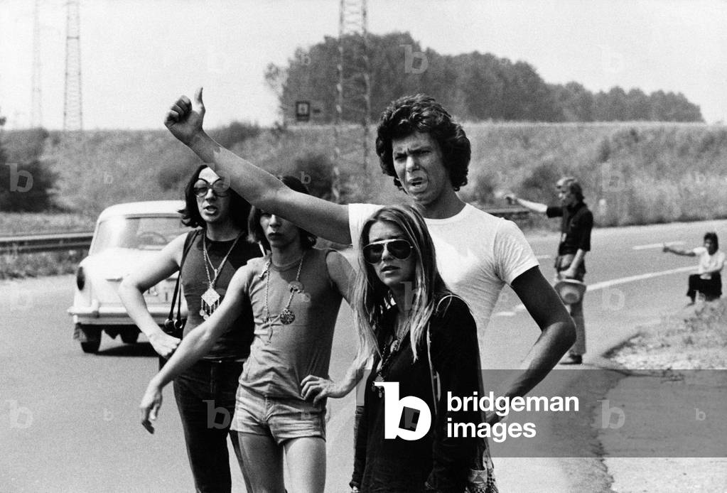 Tourists hitchhiking