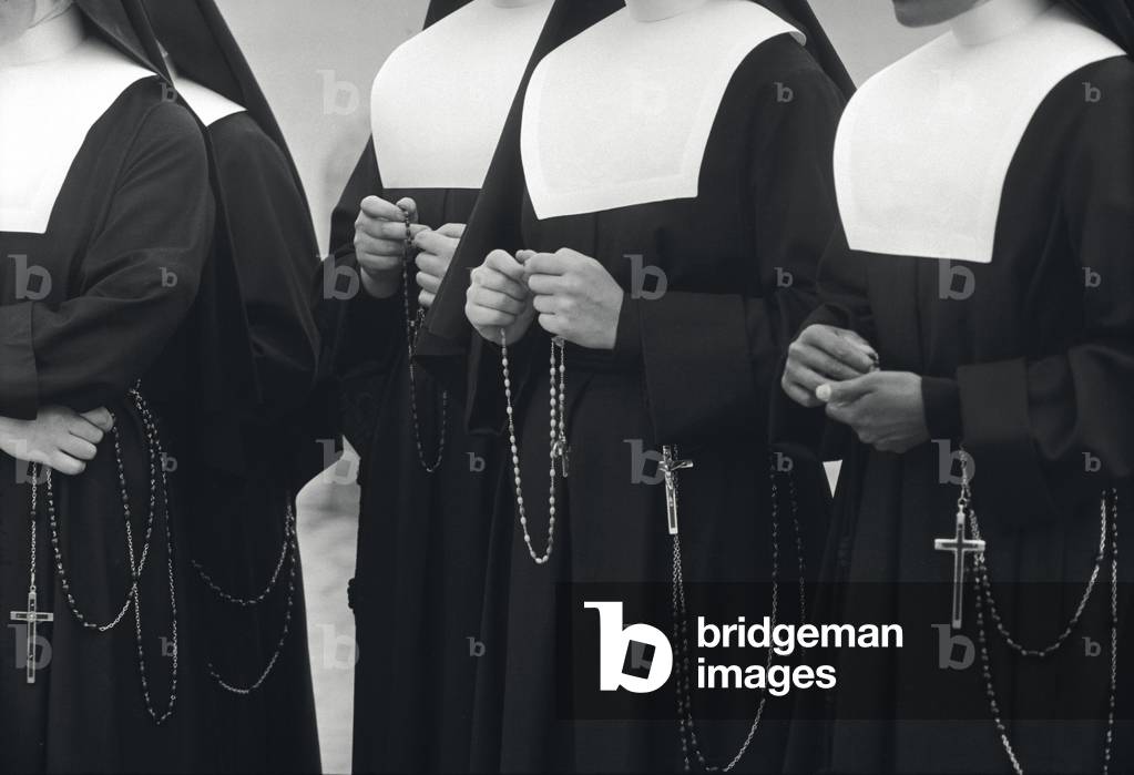 Nuns saying their rosary