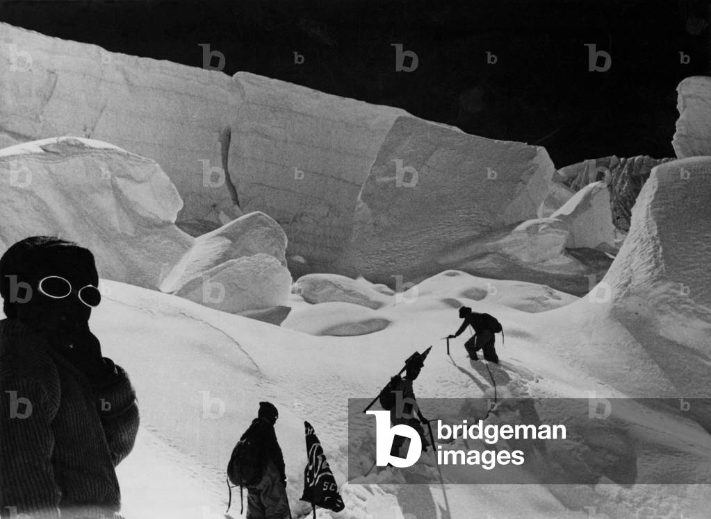 Alpinists walking in the snow
