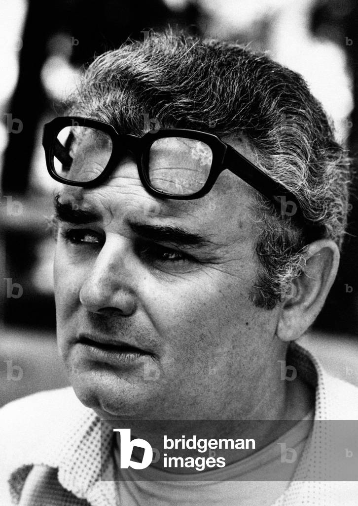 Close-up of Pino Calvi with his eyeglasses on his forehead