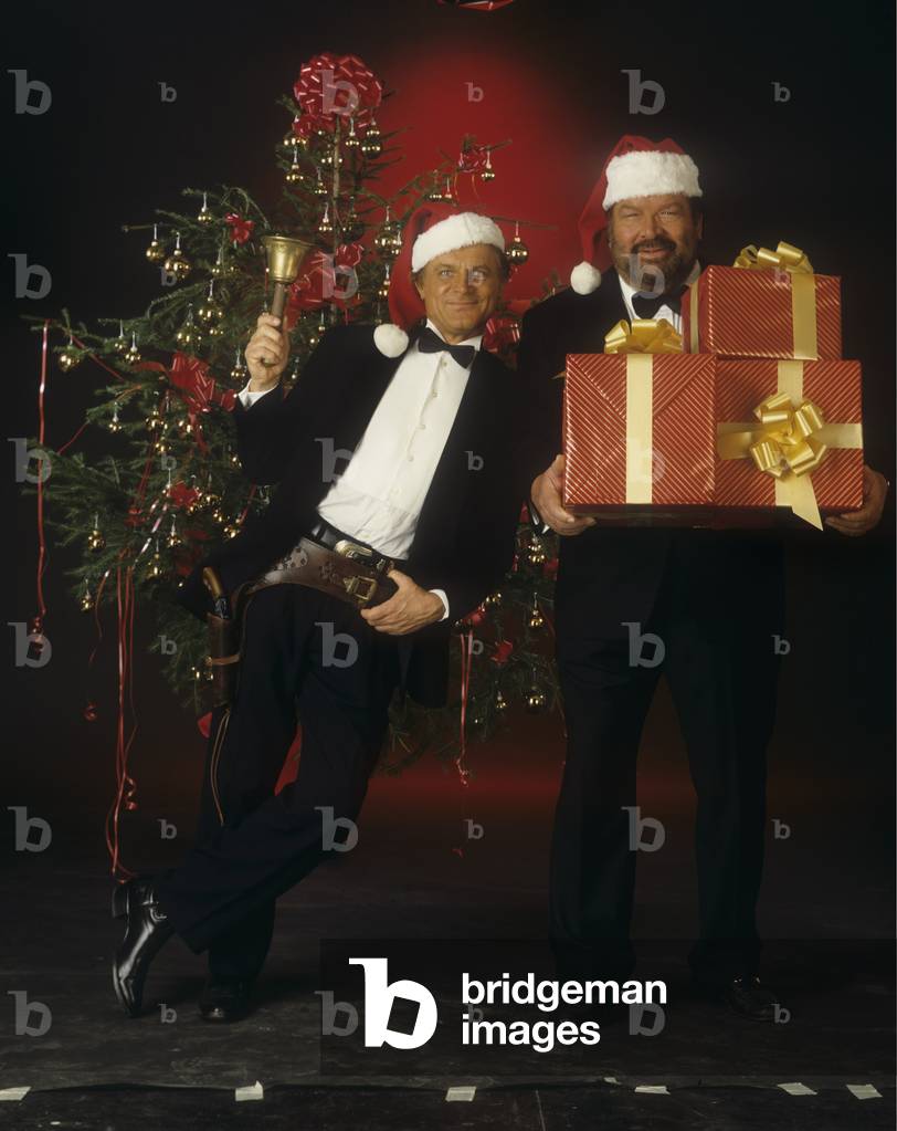 Terence Hill and Bud Spencer posing in front of a Christmas tree, Italy