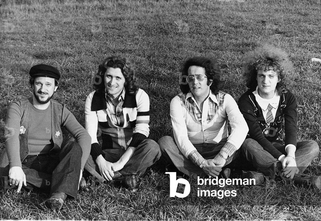 Homo Sapiens sitting on a lawn