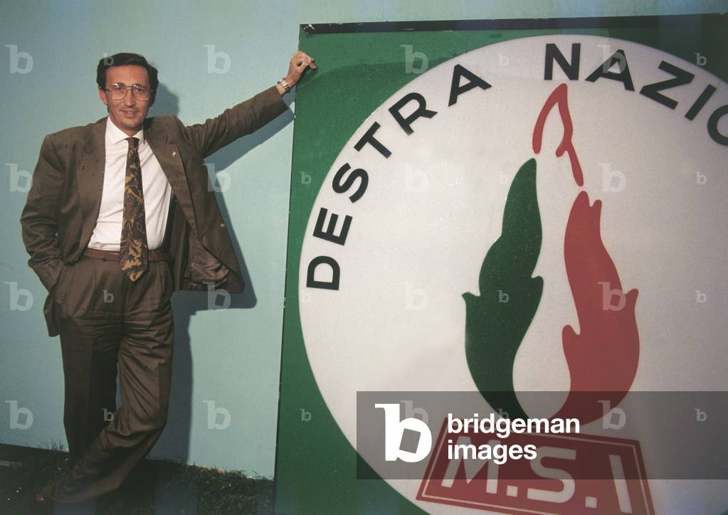 Gianfranco Fini next to the symbol of his party