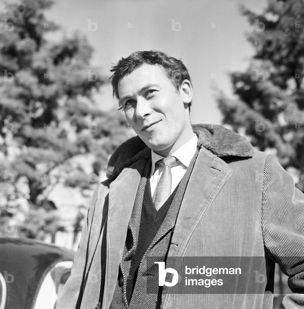 John Osborne coming out of Club theater, Italy, 1959 (b/w photo)