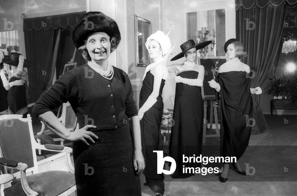 Biki poses with three models in clothes she created