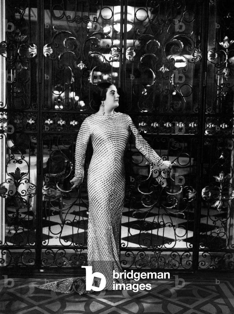 Maria Caniglia posing in front of the precious gate of her house