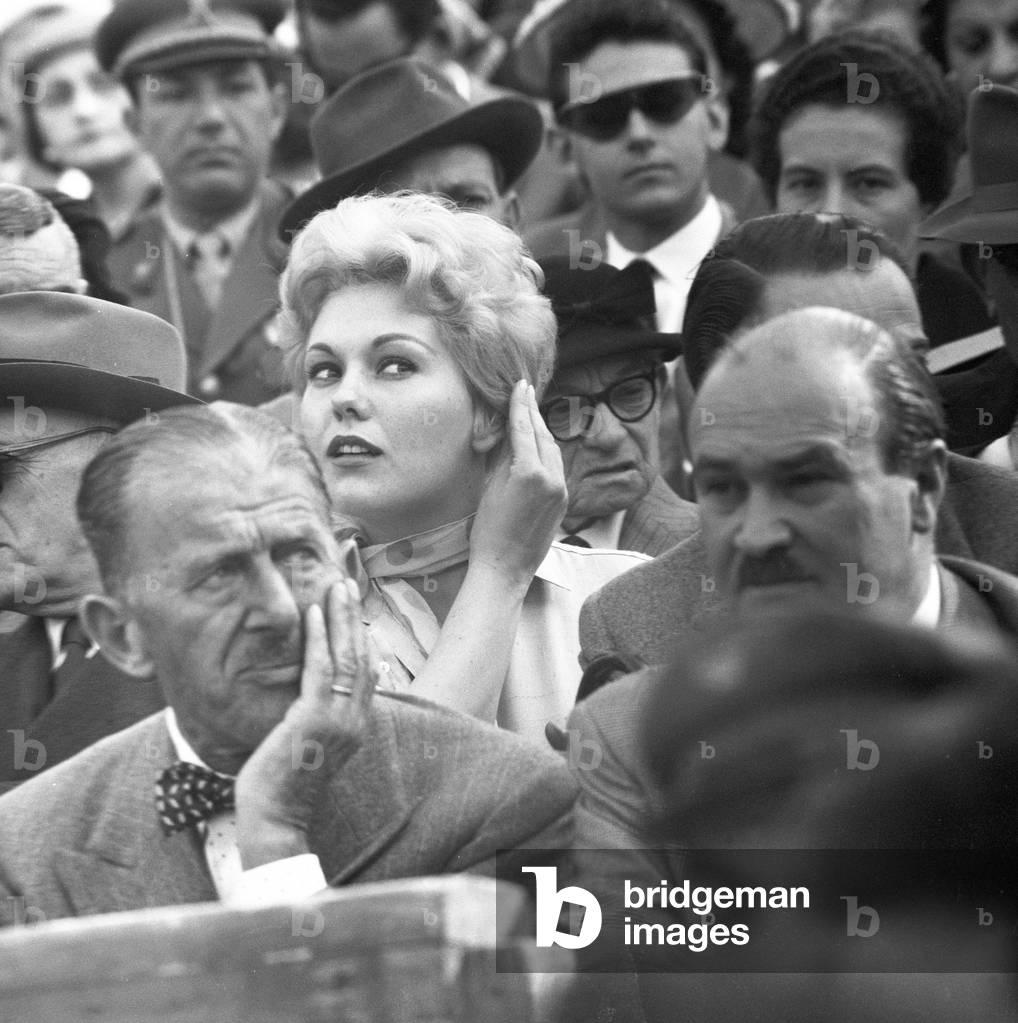 Kim Novak at a horse race, Italy, 1956 (b/w photo)