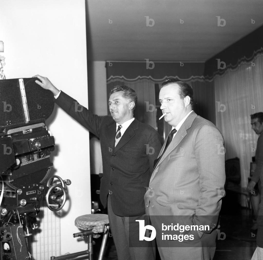 Dino Risi and Mario Cecchi Gori on the film set of Love and Larceny, Italy, 1959 (b/w photo)