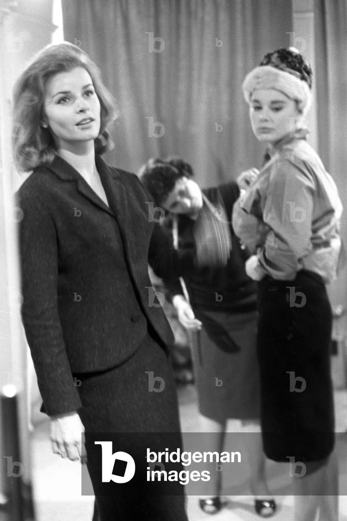 Senta Berger and Elke Sommer posing in a tailor's shop in London, United Kingdom, London, 1963 (b/w photo)
