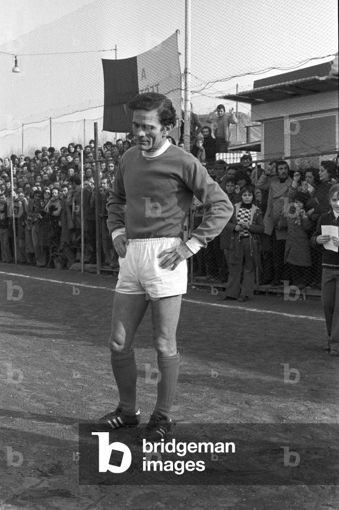 Pier Paolo Pasolini playing football, Italy, 1974 (b/w photo)