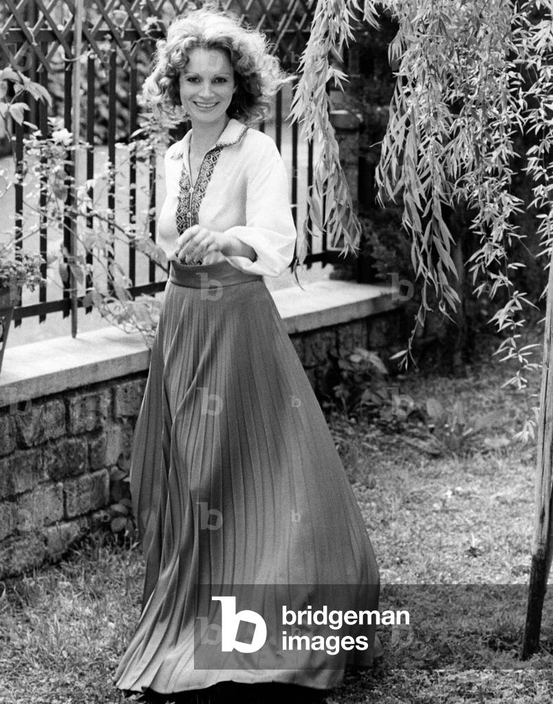 Martine Brochard poses in a garden