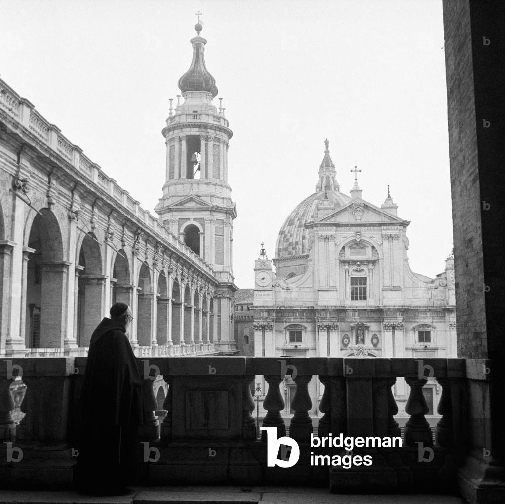 A franciscan friar overlooking Piazza della Madonna in Loreto, Loreto, Italy