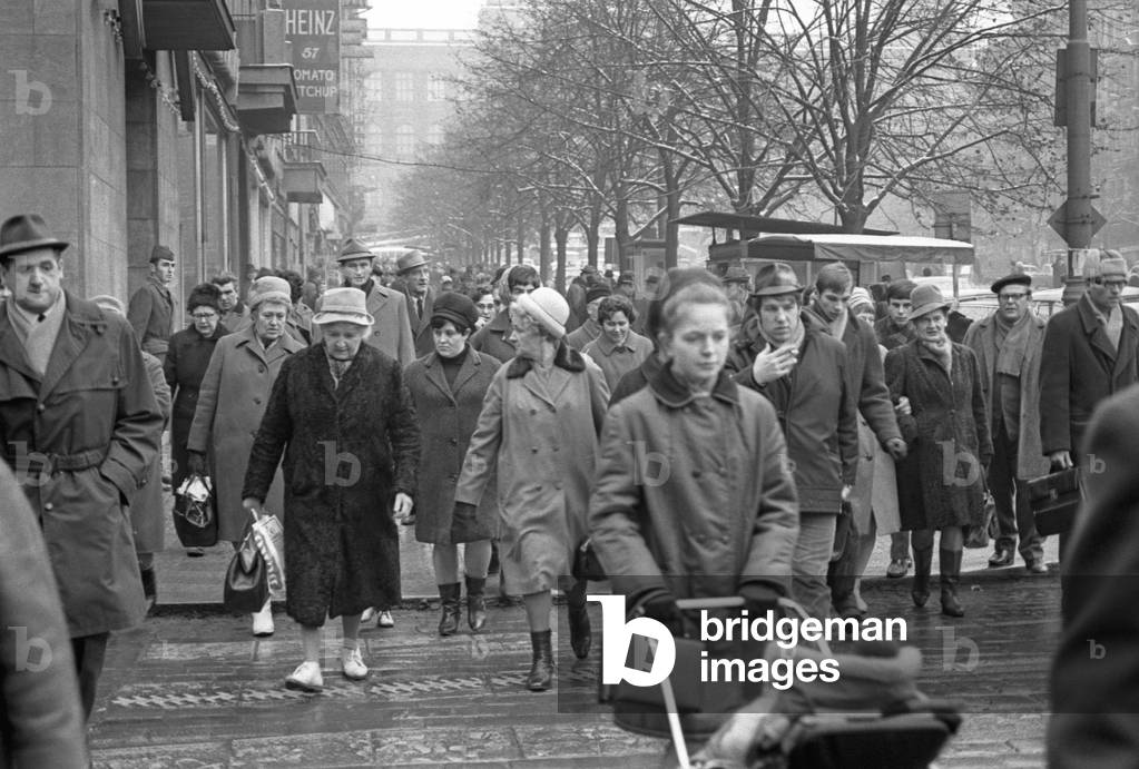Many people crowding the streets on Christmas' Eve, Prague, Czech Republic, December 1968 (b/w photo)