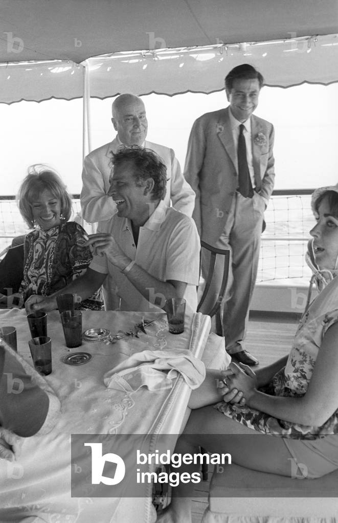 Liz Taylor, Richard Burton and Monica Vitti on Angelo Rizzoli's yacht, Italy, Ischia, 1966 (b/w photo)