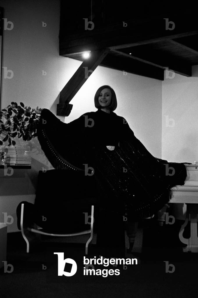 Raffaella Carrà wearing a poncho