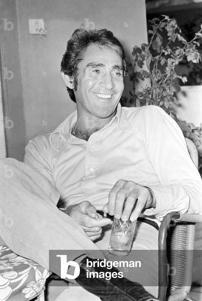 Italian actor, comedian and TV host Walter Chiari portrayed at home, Italy, 1970 (b/w photo)