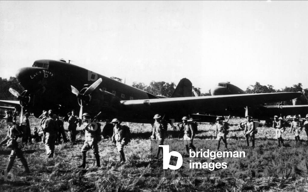 Infantry soldiers beside airplanes