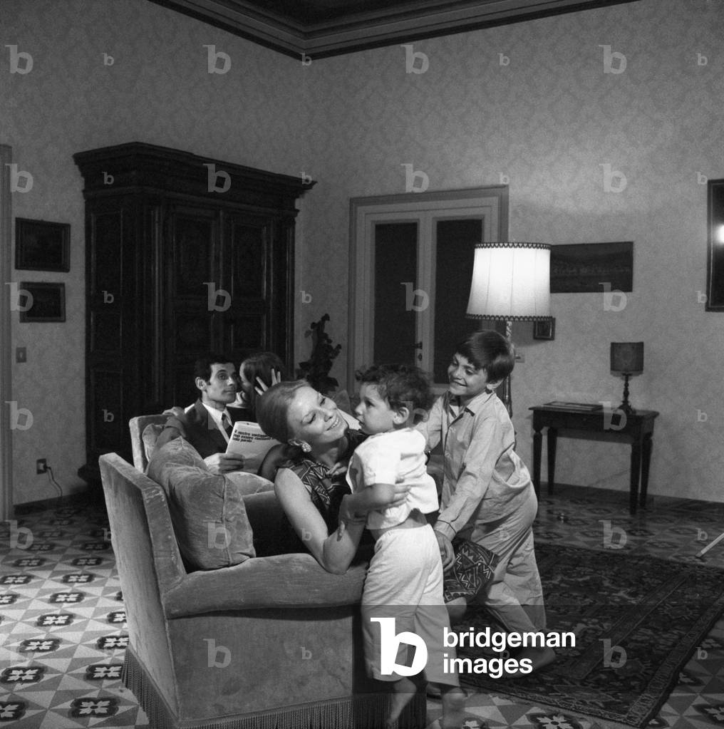 A housewife wishing their three children goodnight, Italy