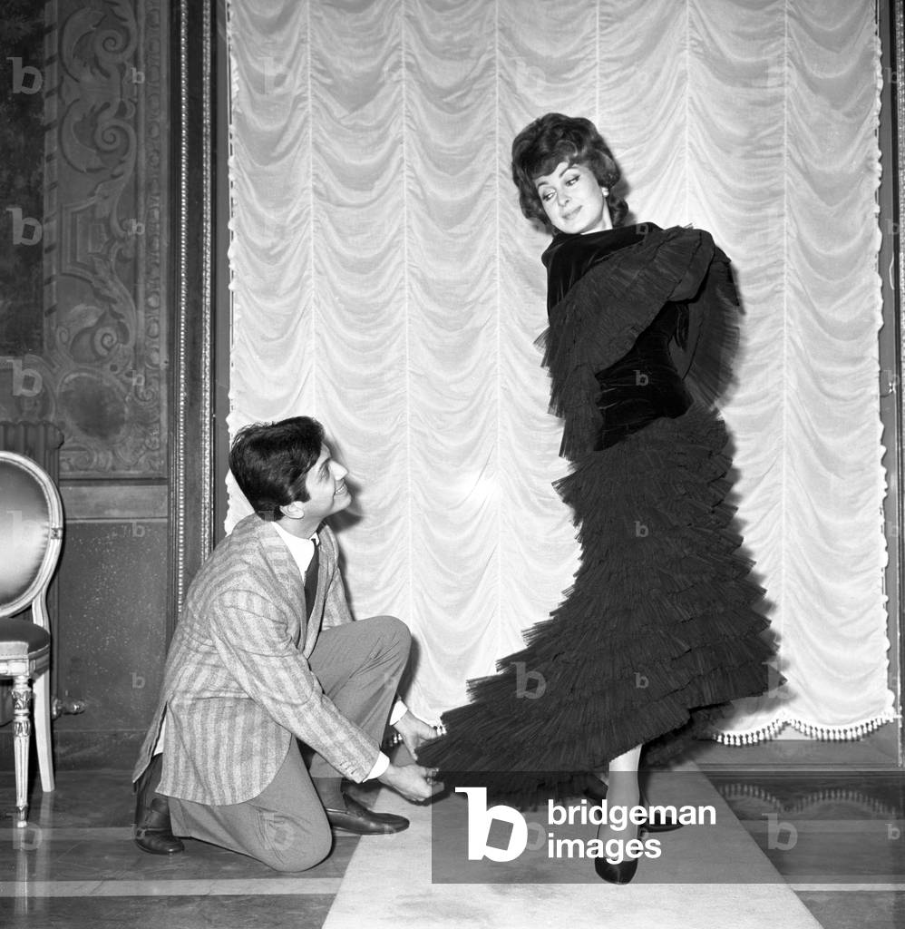 Silvana Pampanini trying on a dress by Valentino, Italy, 1956 (b/w photo)