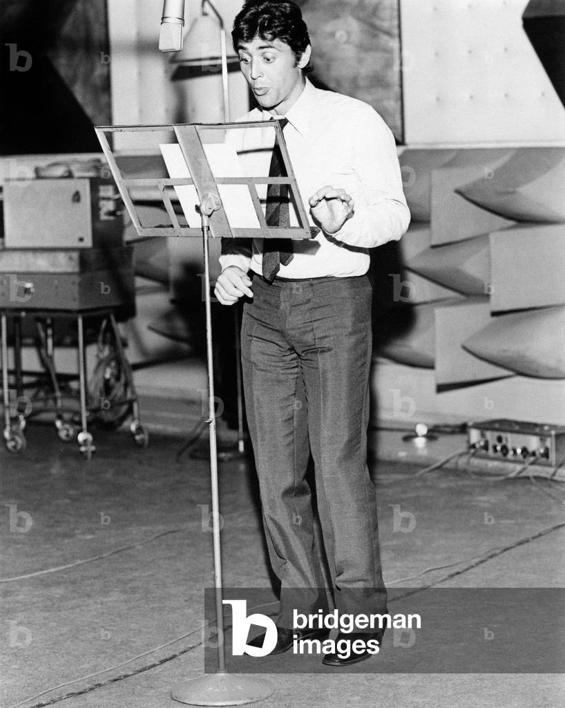 Sacha Distel singing in a recording studio, Great Britain