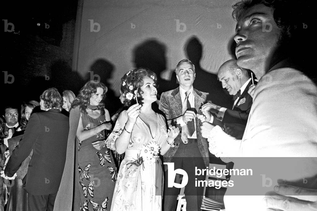 Elizabeth Taylor and Franco Zeffirelli attending the David di Donatello award ceremony, Taormina, Italy, 1972 (b/w photo)