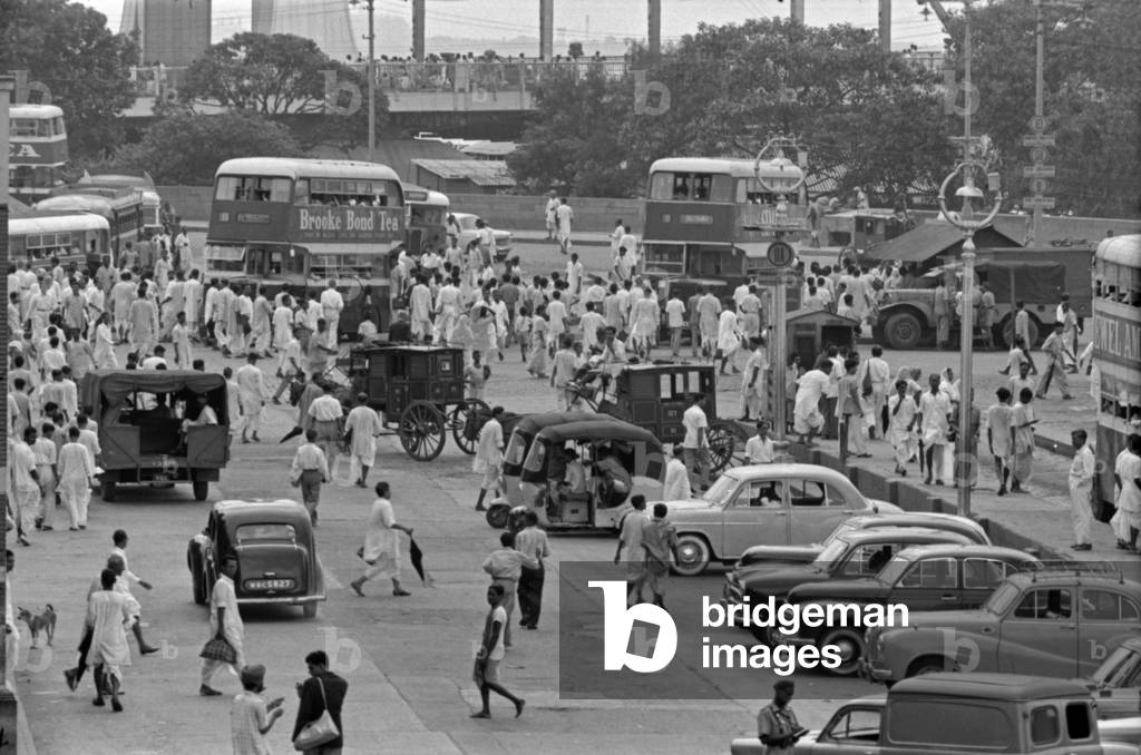 People passing through a street, Kolkata, India, 1962 (b/w photo)
