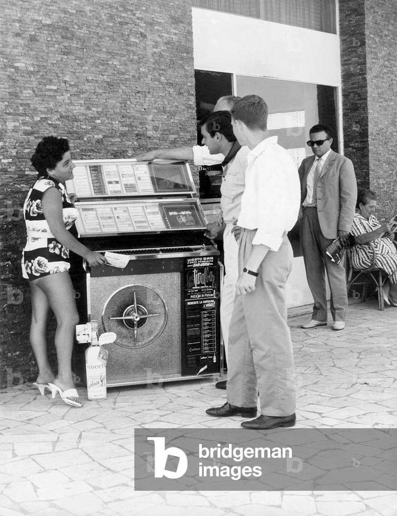 A Jukebox attracting a group of young, Rome, Italy