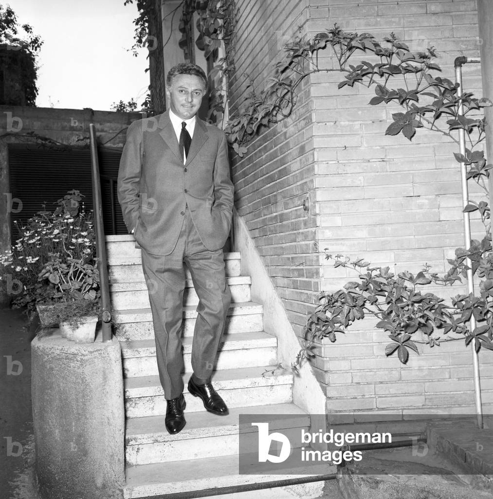Dino Risi walking down the stairs, Italy, 1960 (b/w photo)