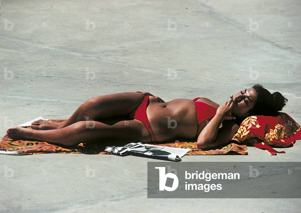 Woman smoking in the sun