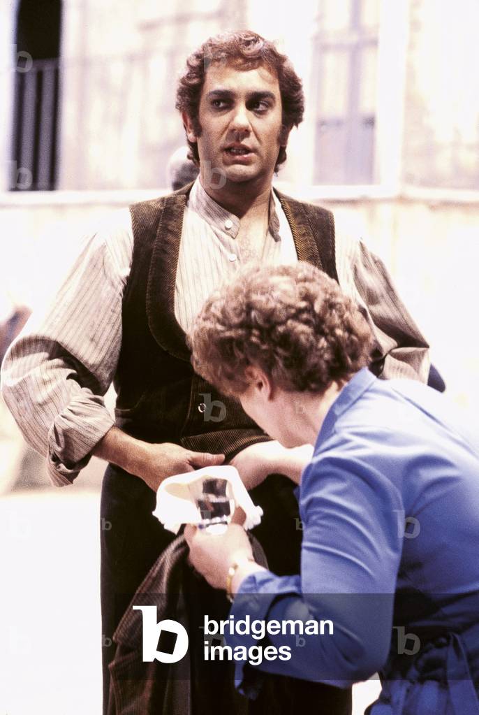 Placido Domingo gets his stage costume fixed during the rehearsal of 'Cavalleria Rusticana' at La Scala, Milan 1981