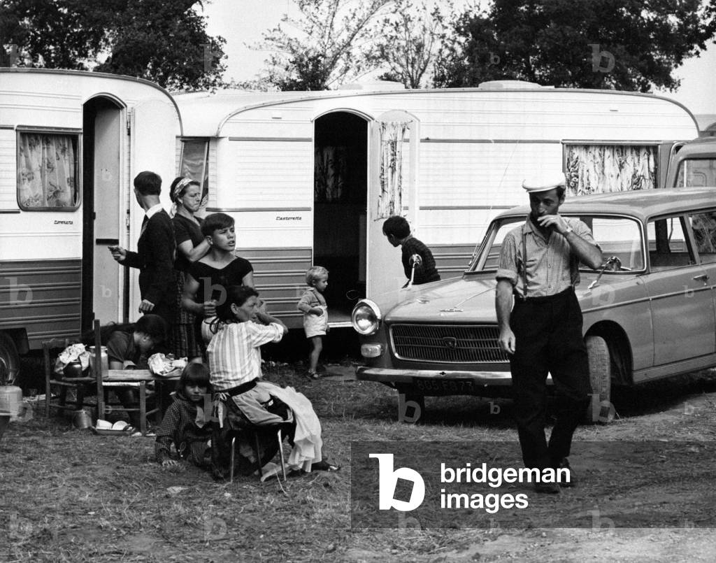 A family of gypsies, among some caravans, 1965 (b/w photo)