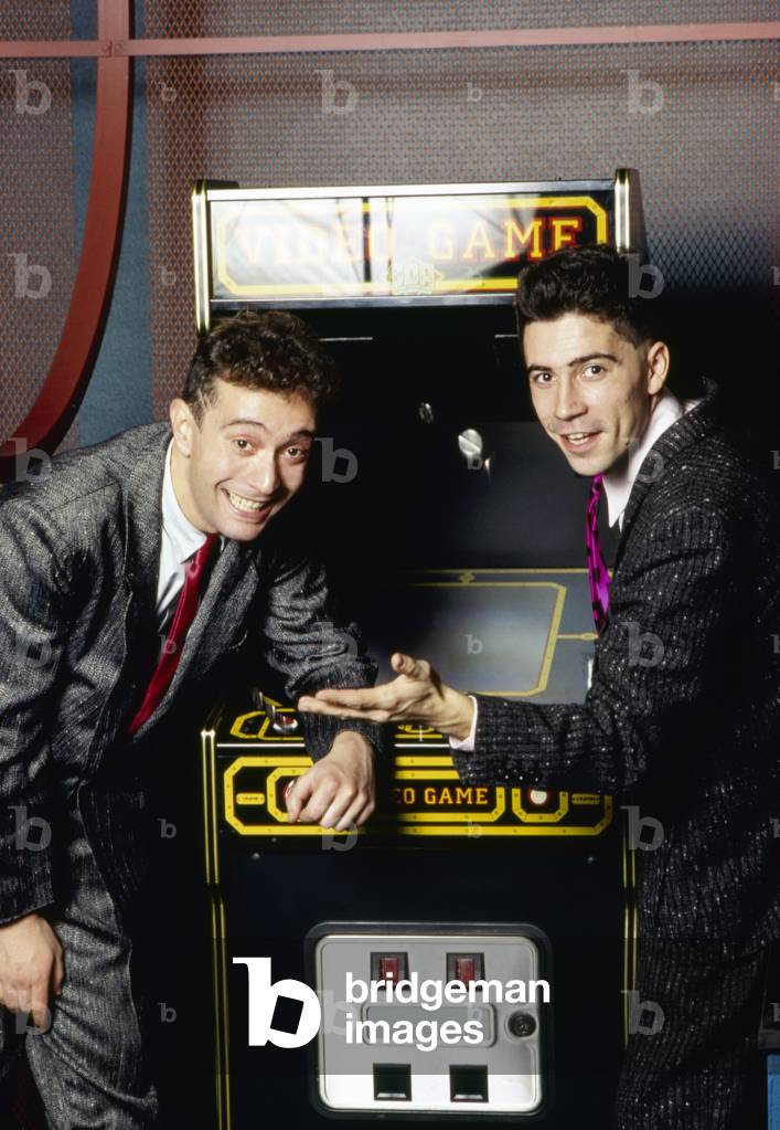 Righeira posing in front of a video game controller, Italy