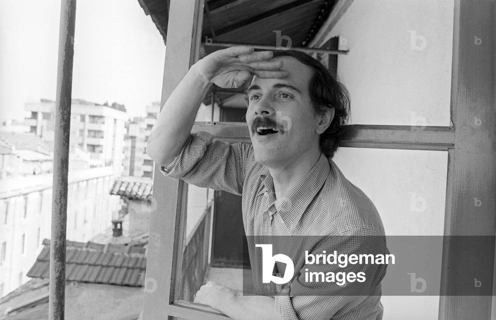 Portrait of Giovanni Pascutto watching the horizon on a balcony
