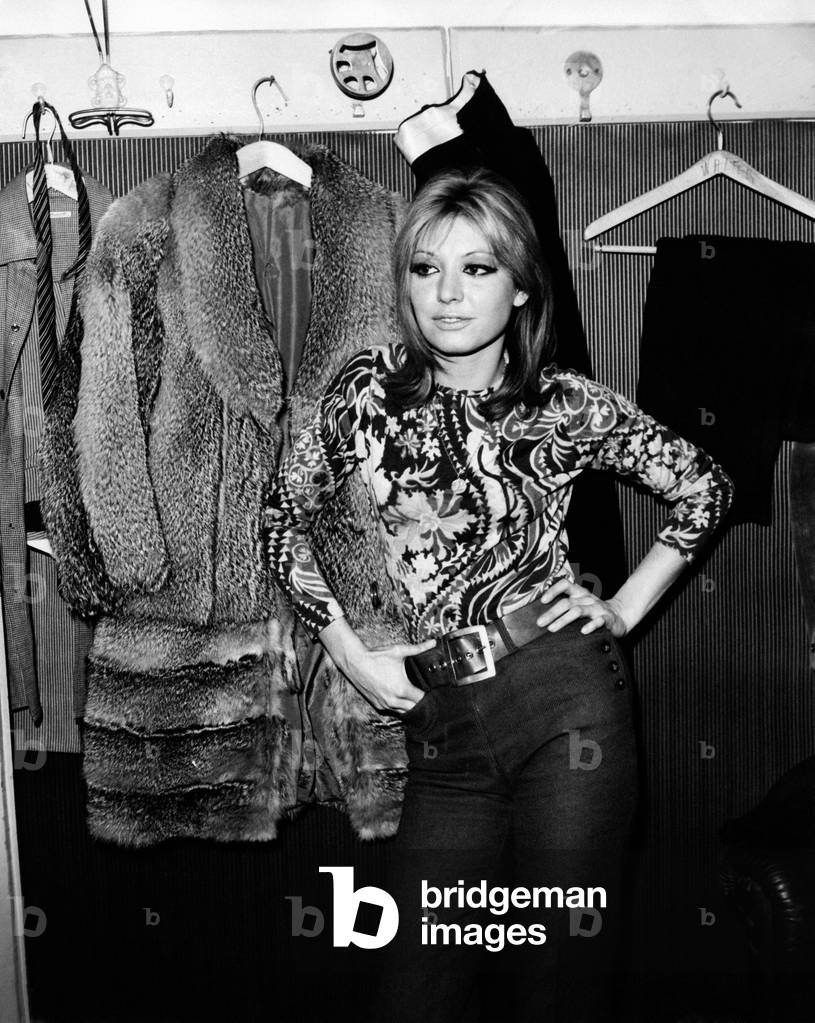 Alida Chelli poses in a dressing room