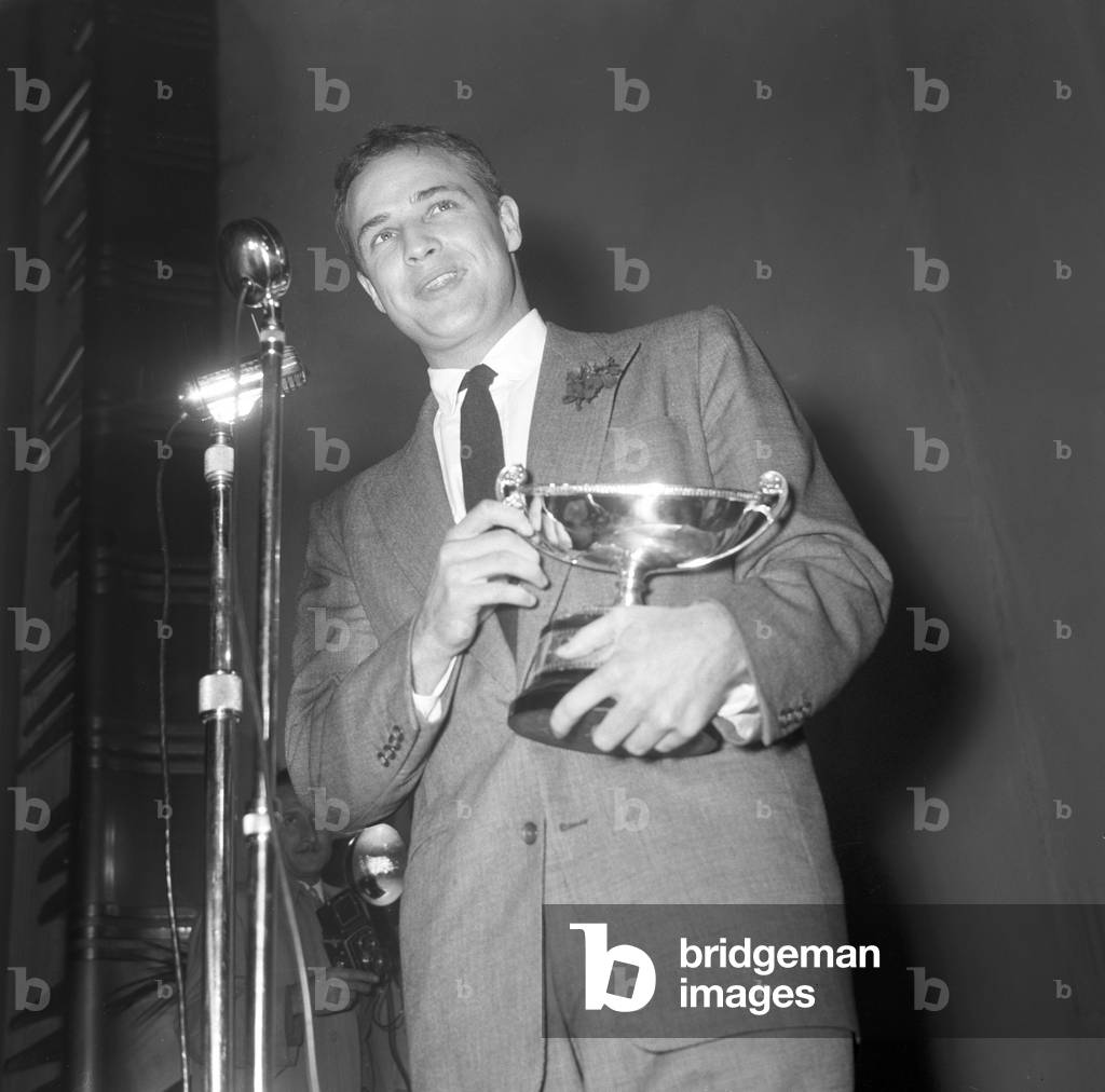 Marlon Brando getting an award, 1954 (b/w photo)