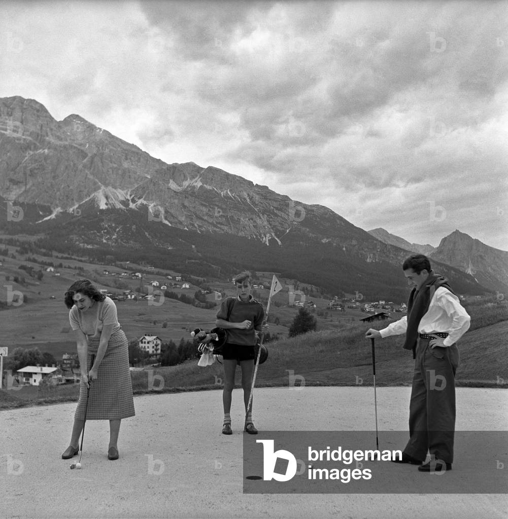 Tourists playing golf, Cortina d'Ampezzo, Italy