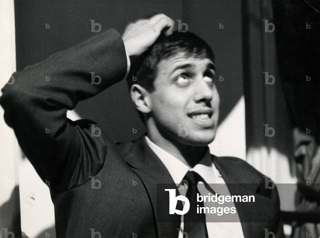 Adriano Celentano touching his hair