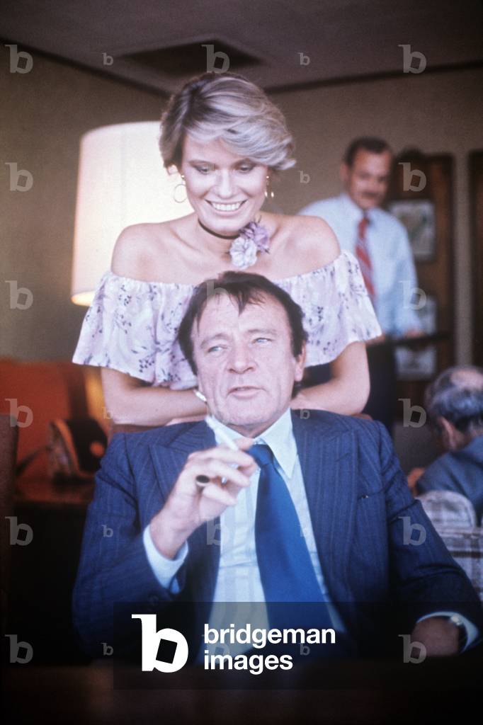 Susan Hunt smiling behind Richard Burton