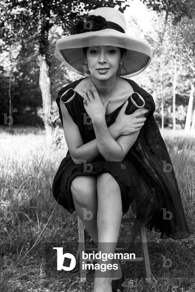Marisa Del Frate sitting on a chair in the park