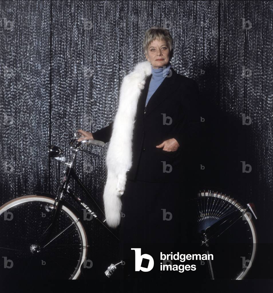 Alida Valli near a bike