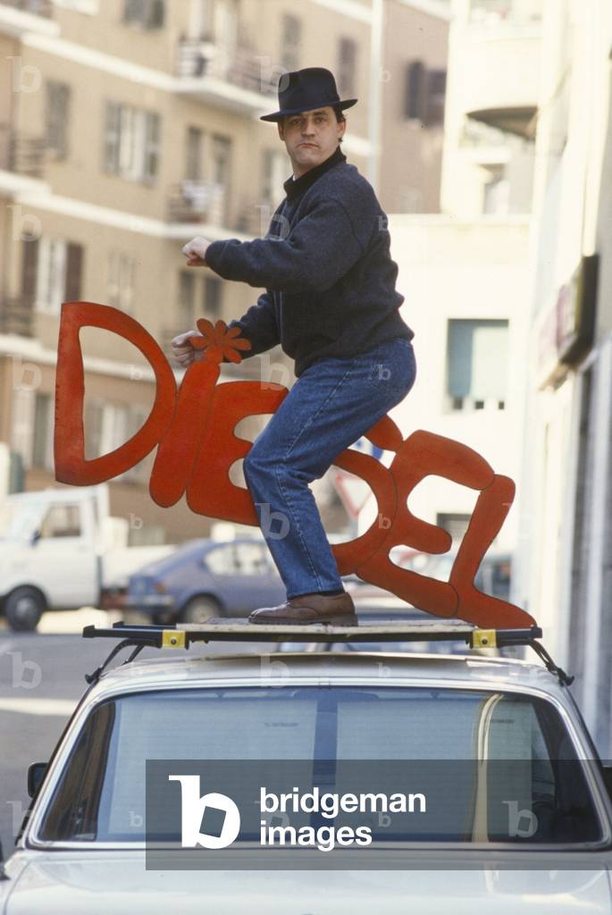 Francesco Salvi on the hood of a car, Italy